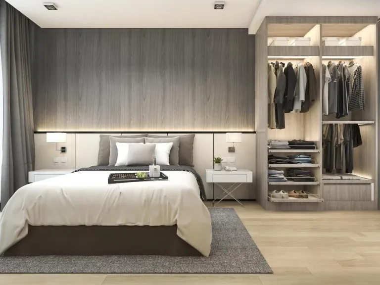 a bedroom with a large bed and a closet